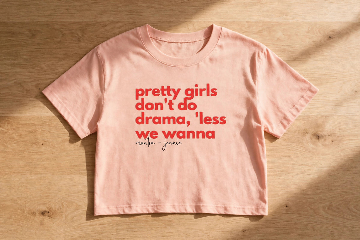 Less We Wanna Graphic Crop Top – 180 GSM – flat-lay on table