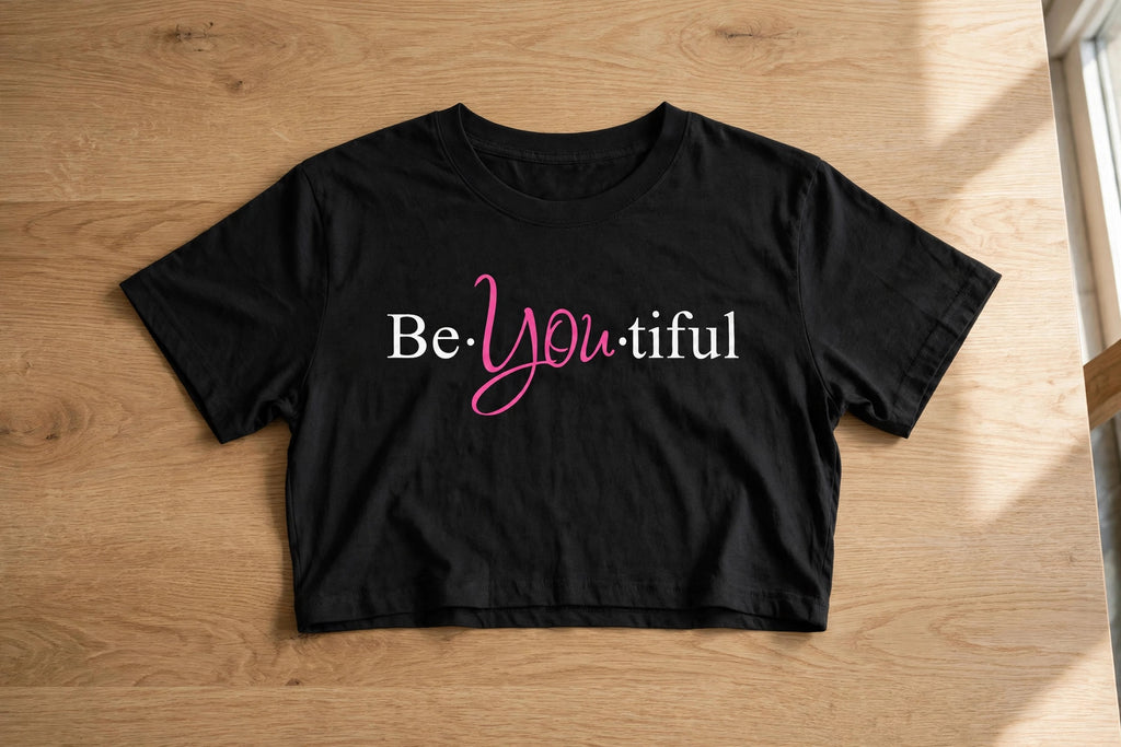 Be-You-Tiful Graphic Crop Top – 180 GSM – flat-lay on table