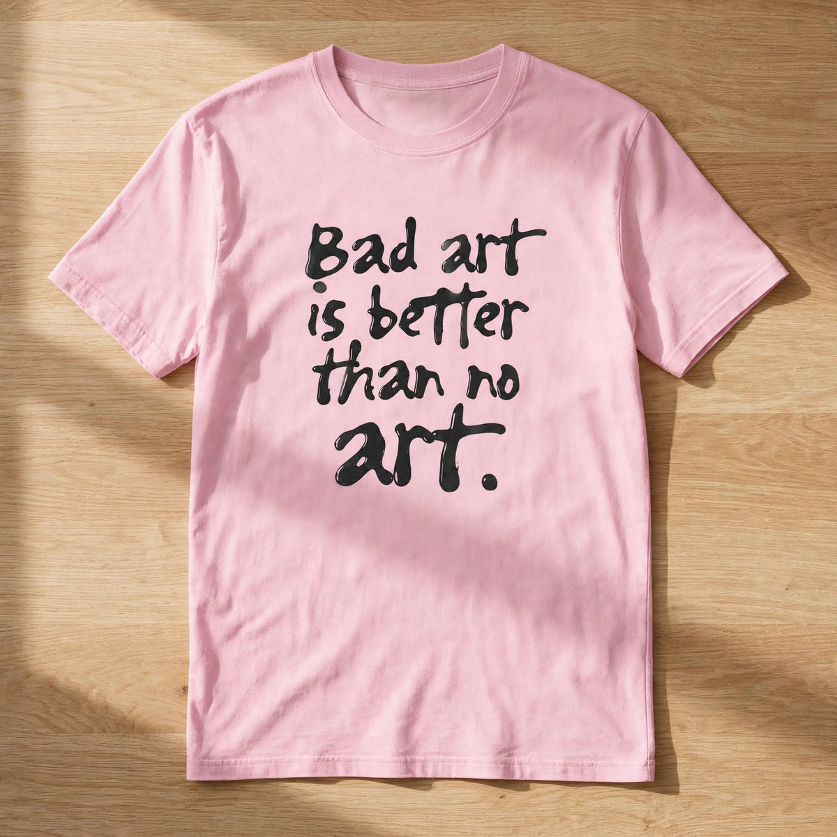 Bad Art Quote Tee – Half Sleeve 180 GSM – flat-lay on table