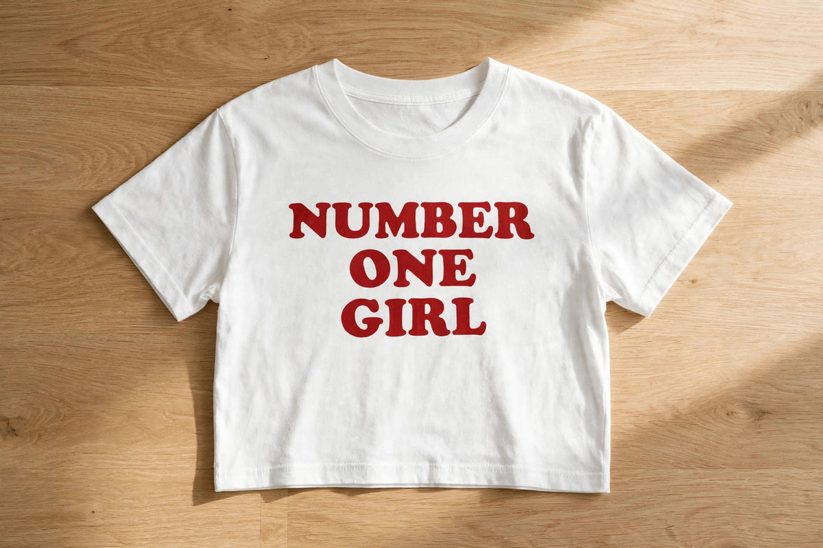 Number One Girl Graphic Crop Top – 180 GSM – flat-lay on table