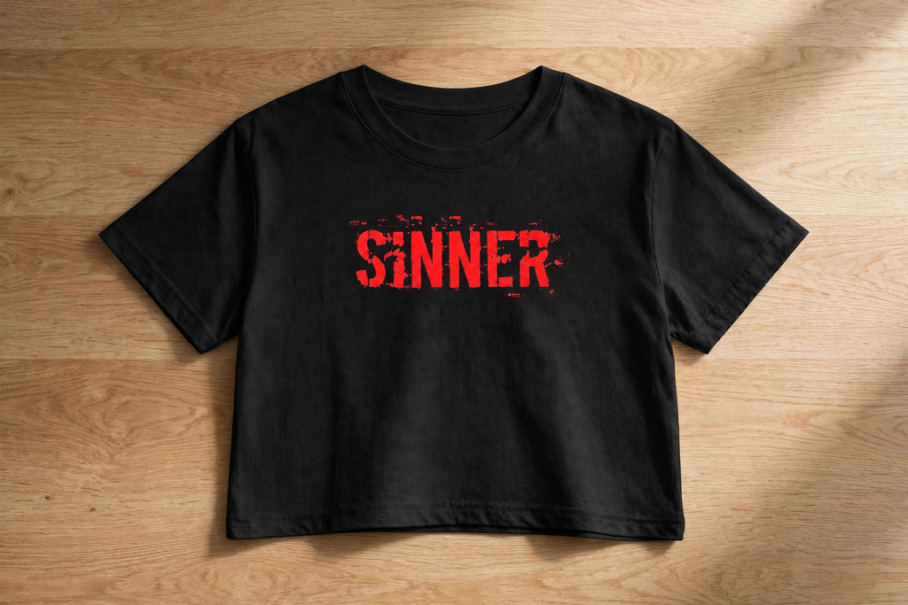 Sinner Graphic Crop Top – 180 GSM – flat-lay on table