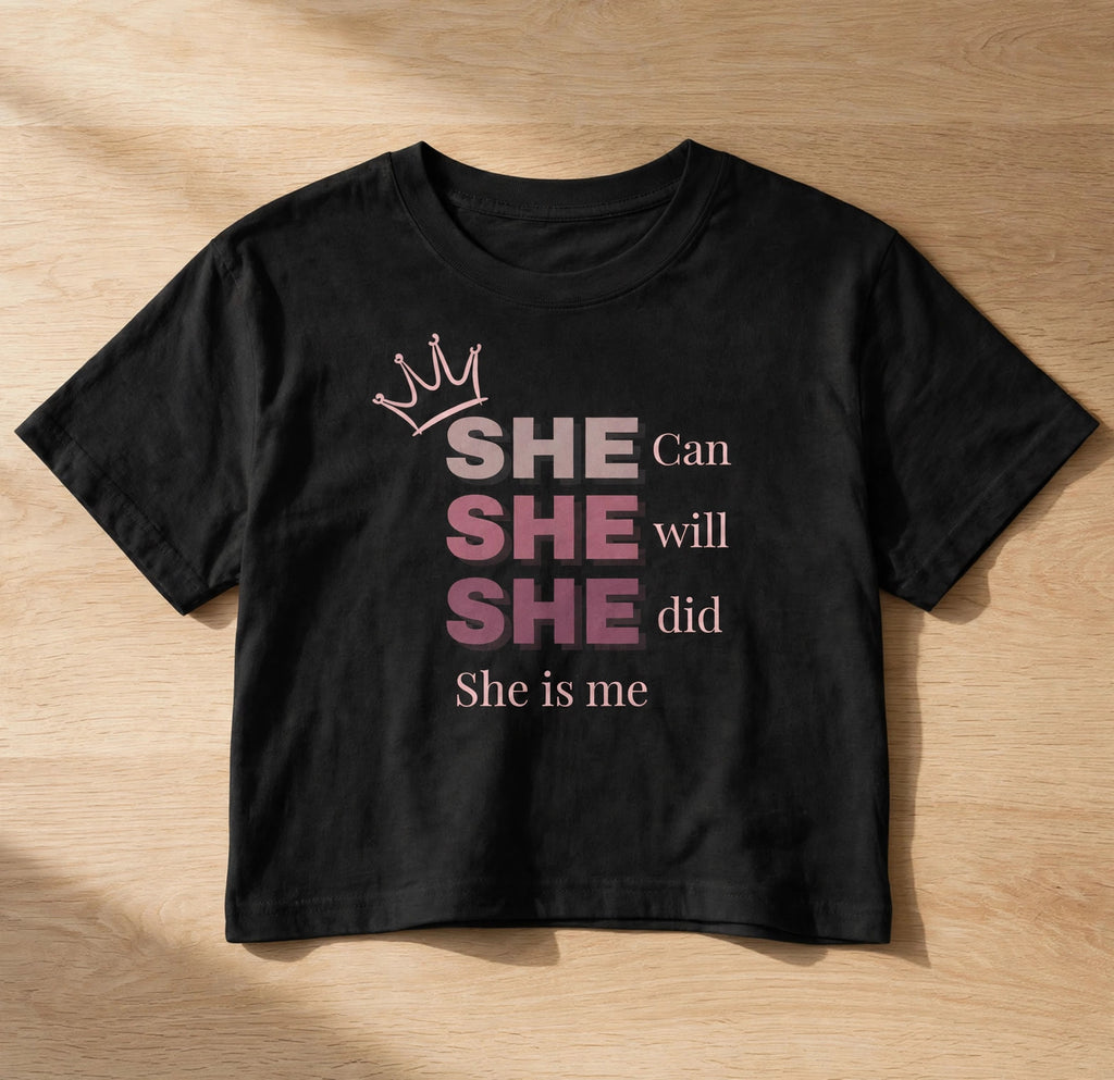 She Is Me Graphic Crop Top – 180 GSM – flat-lay on table